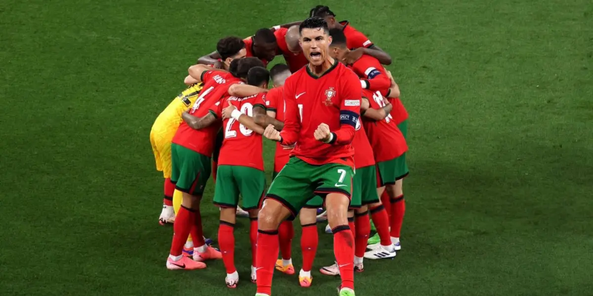 Cristiano Ronaldo celebrates with passion while the background includes the Portugal national team hugging each other. (Source: GOATTWORLD X)