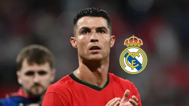 Cristiano Ronaldo claps to the fans while wearing the Portugal jersey and the Real Madrid badge is next to him. (Source: GOATTWORLD X)