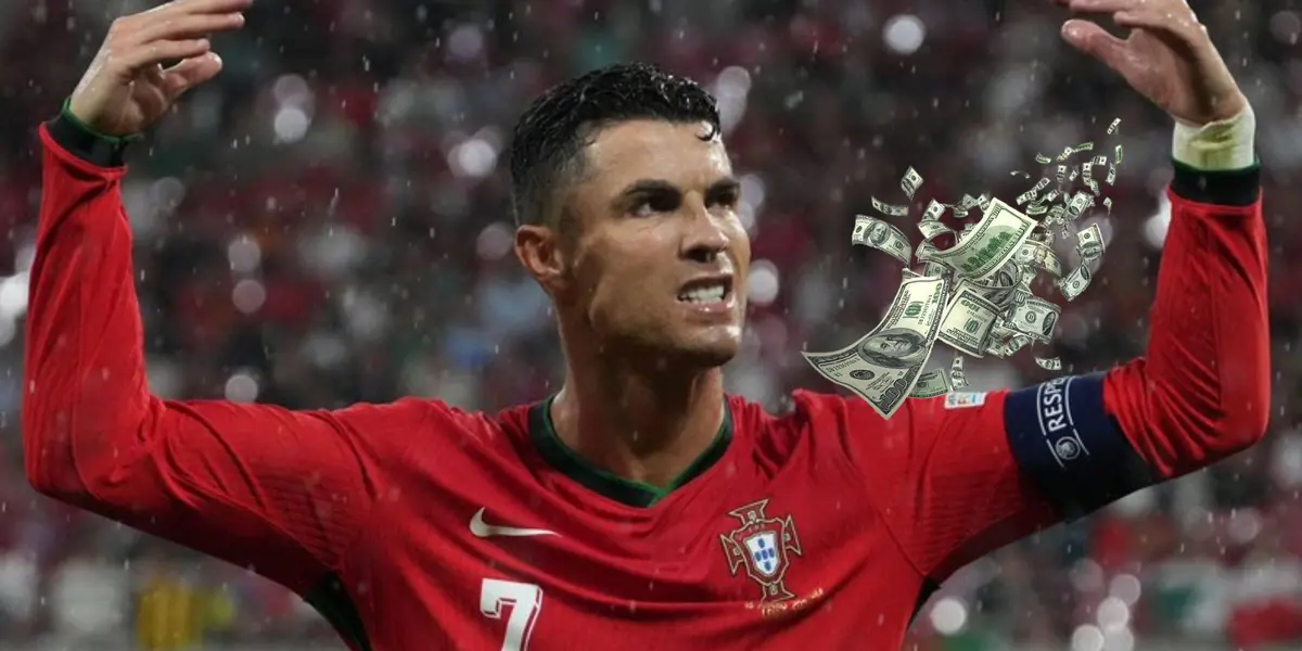 Cristiano Ronaldo puts his hands up while wearing the Portuguese jersey and flying money is next to him. (Source: GOATTWORLD X)