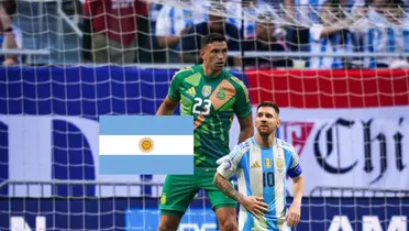 Emiliano Martinez wears the goalkeeper kit while Lionel Messi looks on and the Argentina flag is next to him. (Source: Messi Xtra X)
