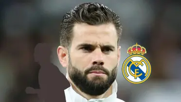 Nacho looks serious while wearing the Real Madrid jacket as a mystery player and the Real Madrid badge is next to him. (Source: Madrid Xtra X)