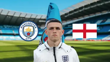 Phil Foden is focused with the England jacket while the Man City badge and the England flag is next to him. (Source: MCFC Lads X)